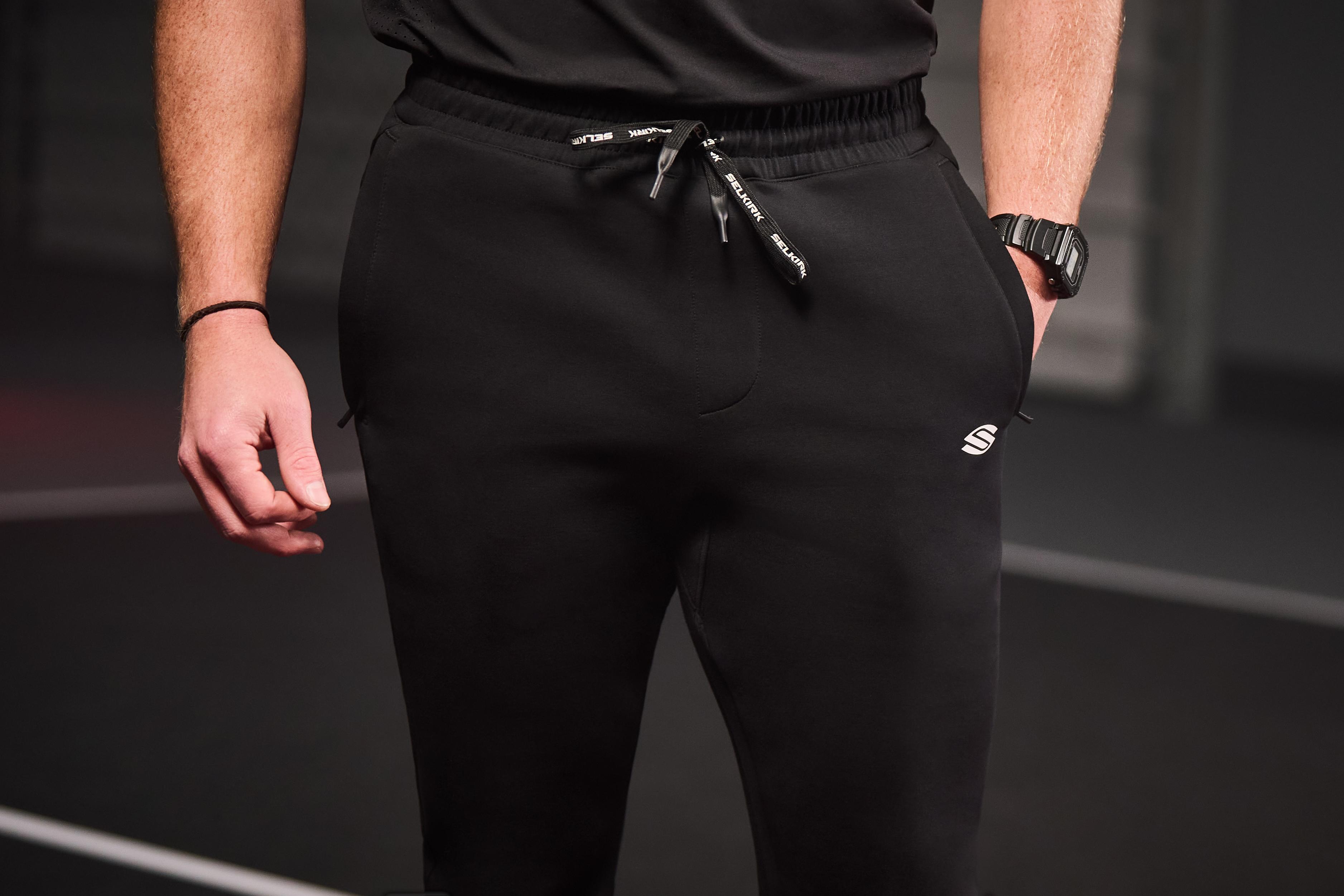 Men's Pro Line Knit Jogger in black, featuring zippered pockets and drawstring waist.