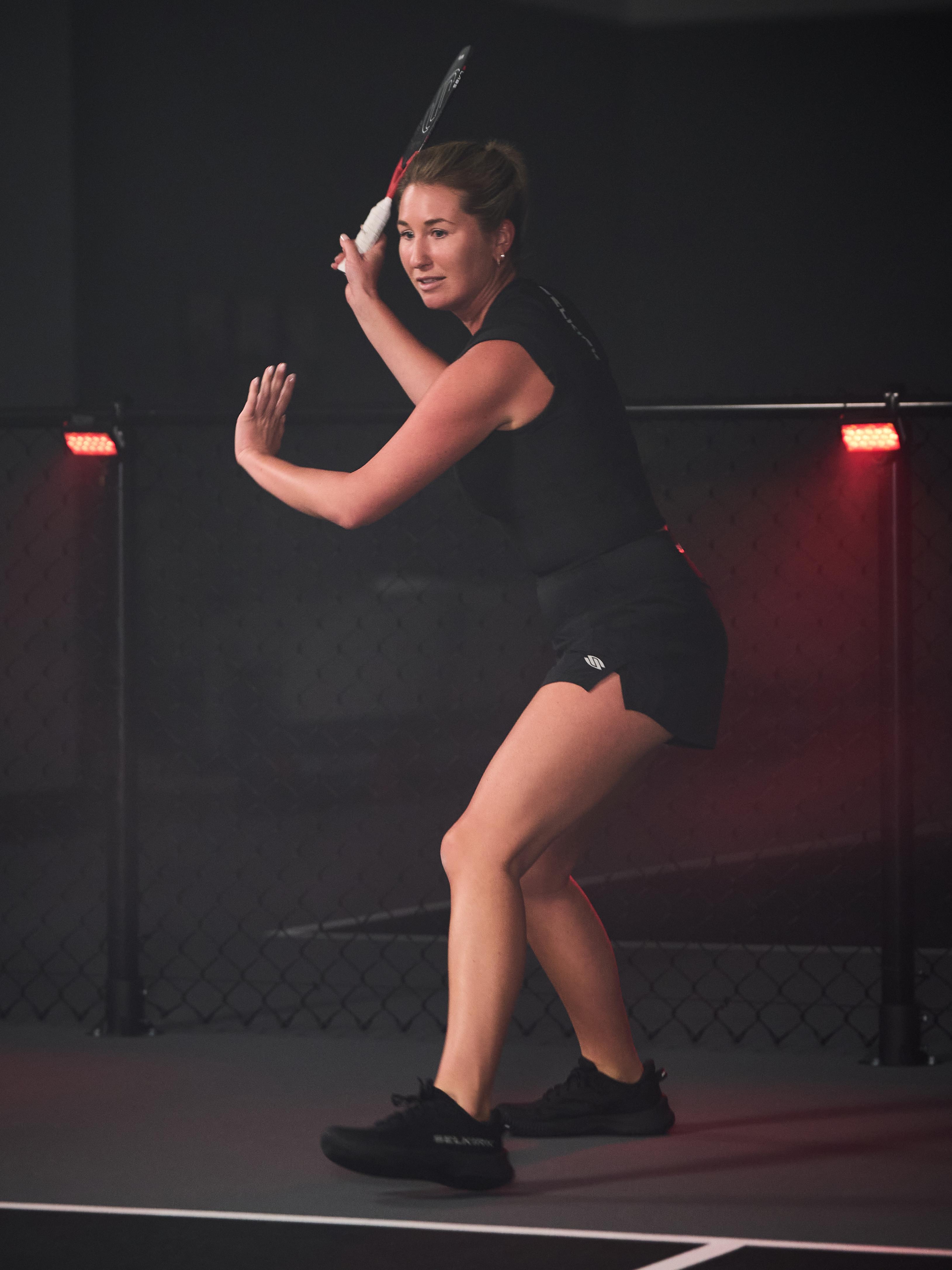 Woman playing pickleball in Selkirk Sport Women's Pro Line Woven Pickleball Shorts