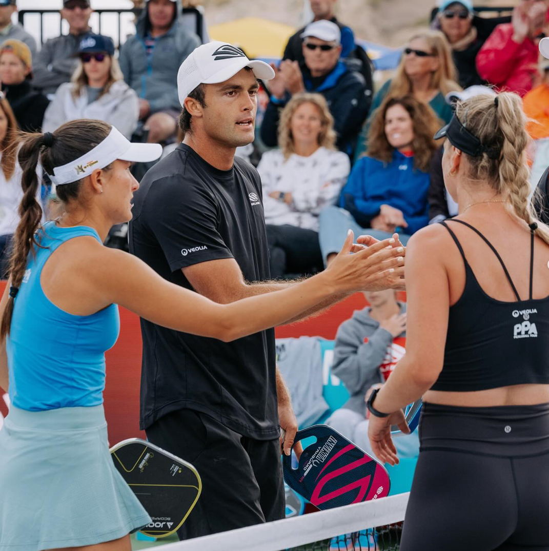 Anna Leigh Waters and Jay Devilliers shake hands with Jessie Irvine after a match.