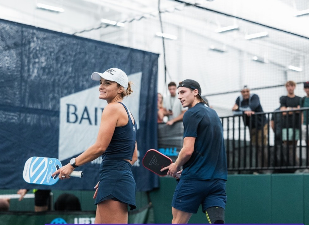 Catherine Parenteau and a male player on the court during a pickleball match