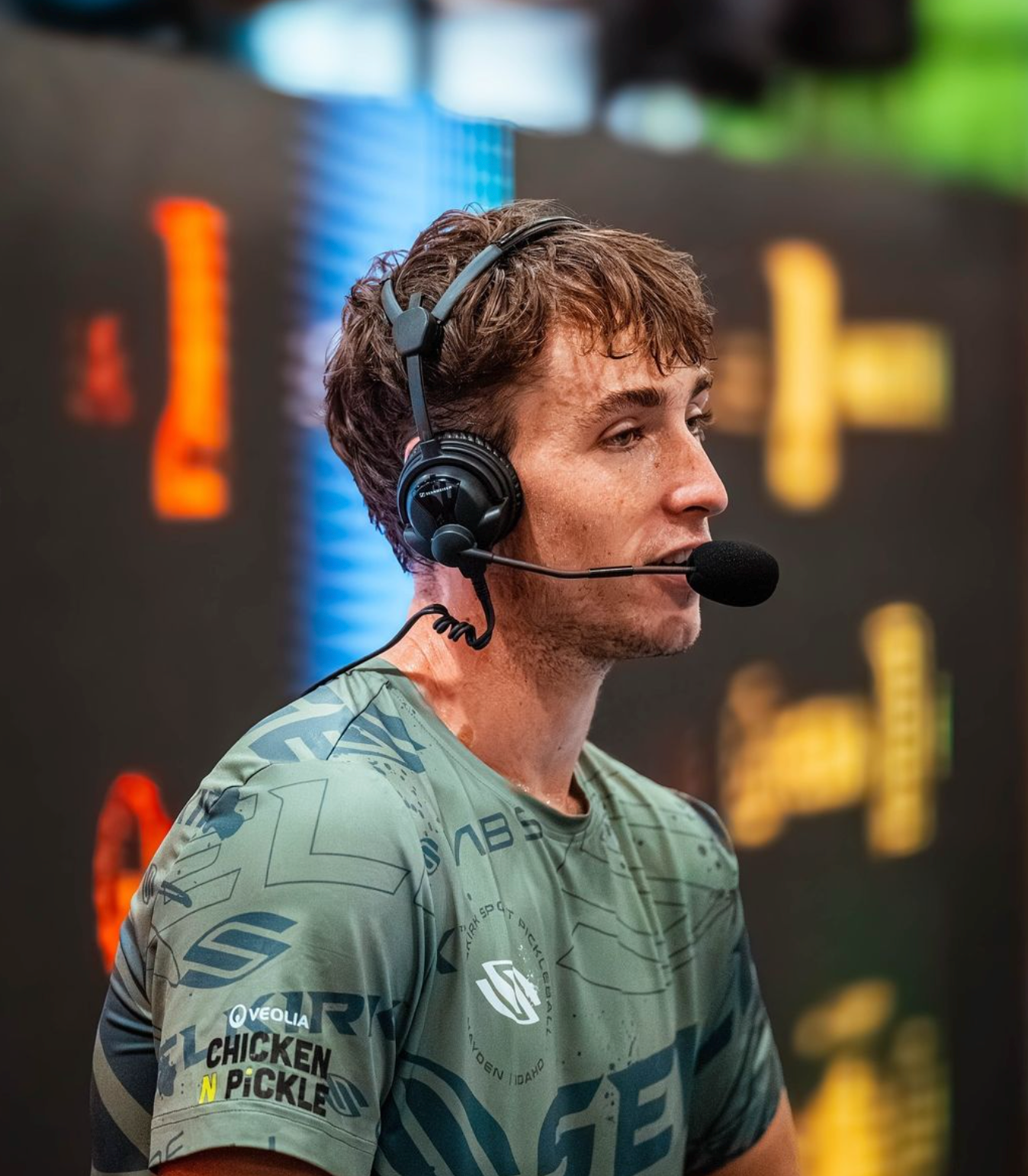 Dylan Frazier speaking into a microphone during the tournament coverage