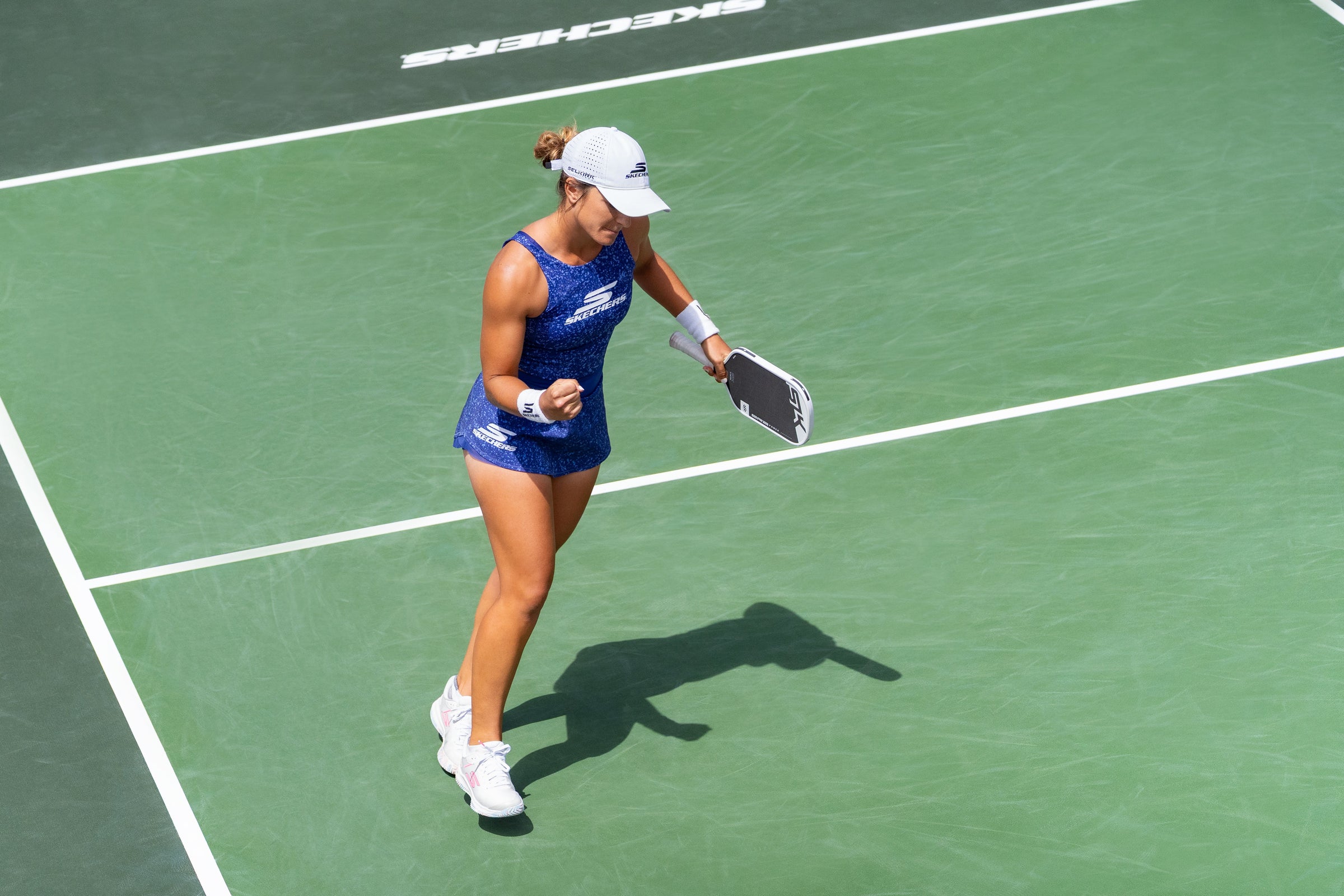 Catherine Parenteau fist pumps after winning a point