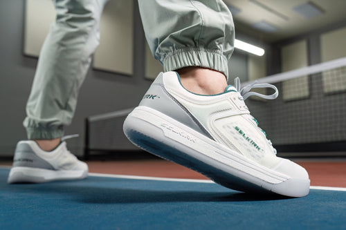 A close-up shows a man's foot wearing the Selkirk Legacy Pro. 