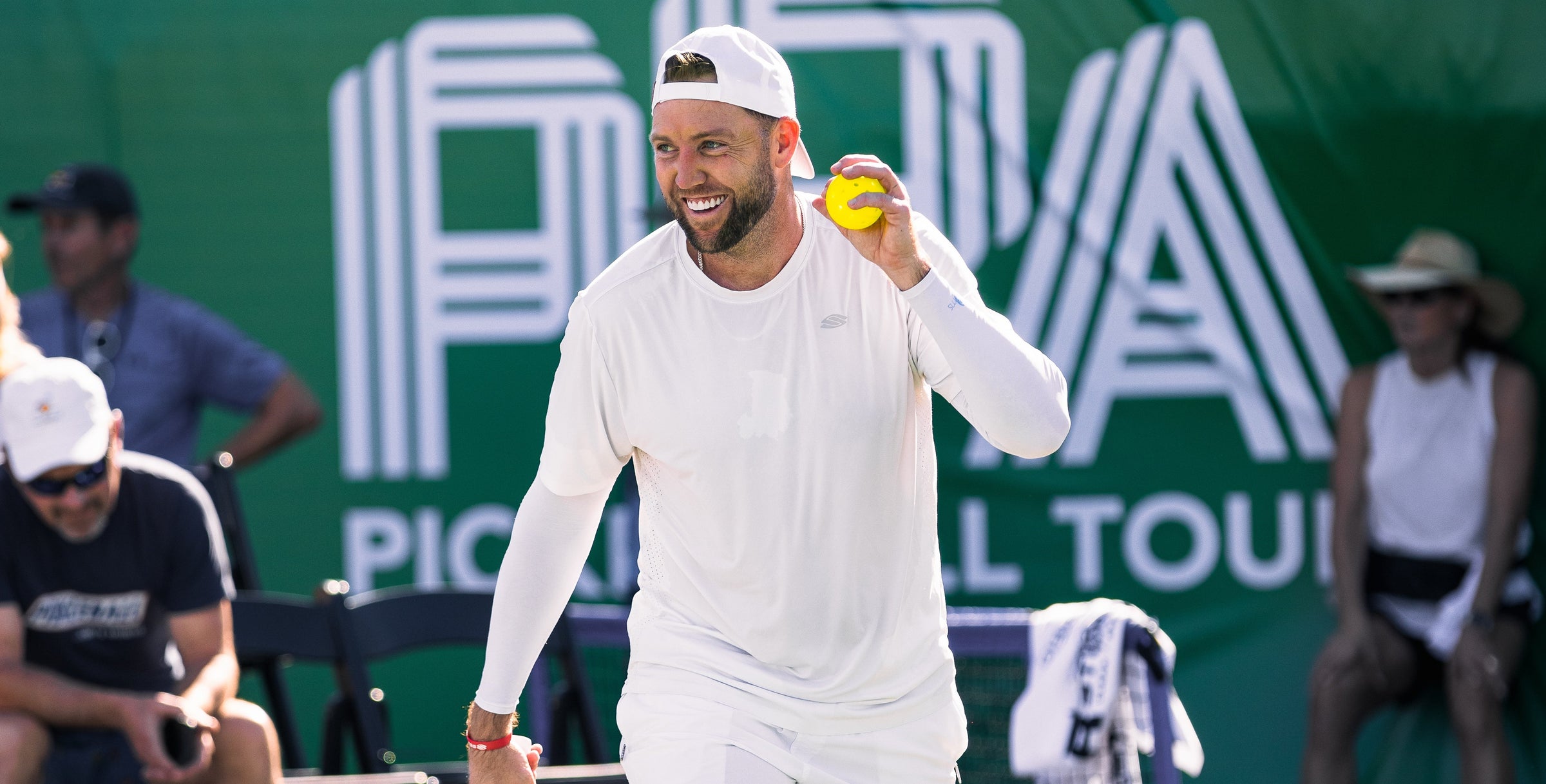 Jack Sock grins after winning a match