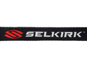 Black woven strap with red emblem and white SELKIRK text, including TM mark