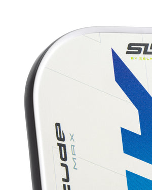 Corner of a Selkirk Slice pickleball paddle, white with blue geometric design, showing 'BY SELKIRK' and MX branding.