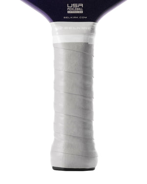 White spiral-wrapped pickleball paddle handle showing branding: USA PICKLEBALL APPROVED, SELKIRK.COM and SELKIRK.