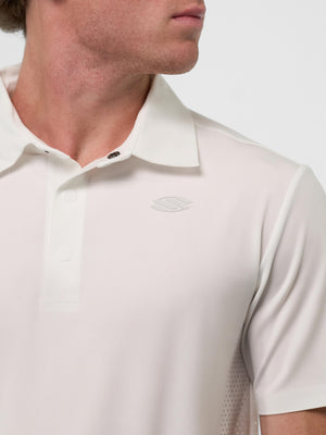Male model wearing white short-sleeve polo with subtle embossed left-chest logo, collar and three-button placket visible.