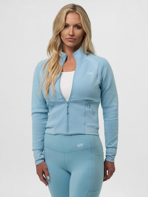 Model wearing a light blue Women's Pro Line Full Zip-Up Cropped Jacket