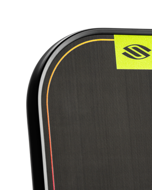 Rounded corner of a black textured mouse pad with thin multicolor border and neon-yellow branded square