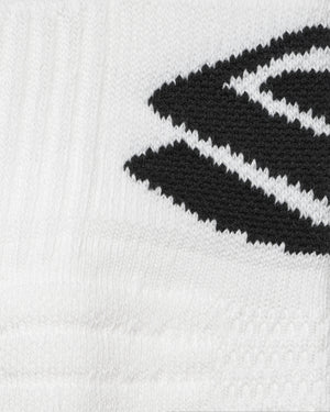 Close-up, white knitted sock with black angled stripe detail