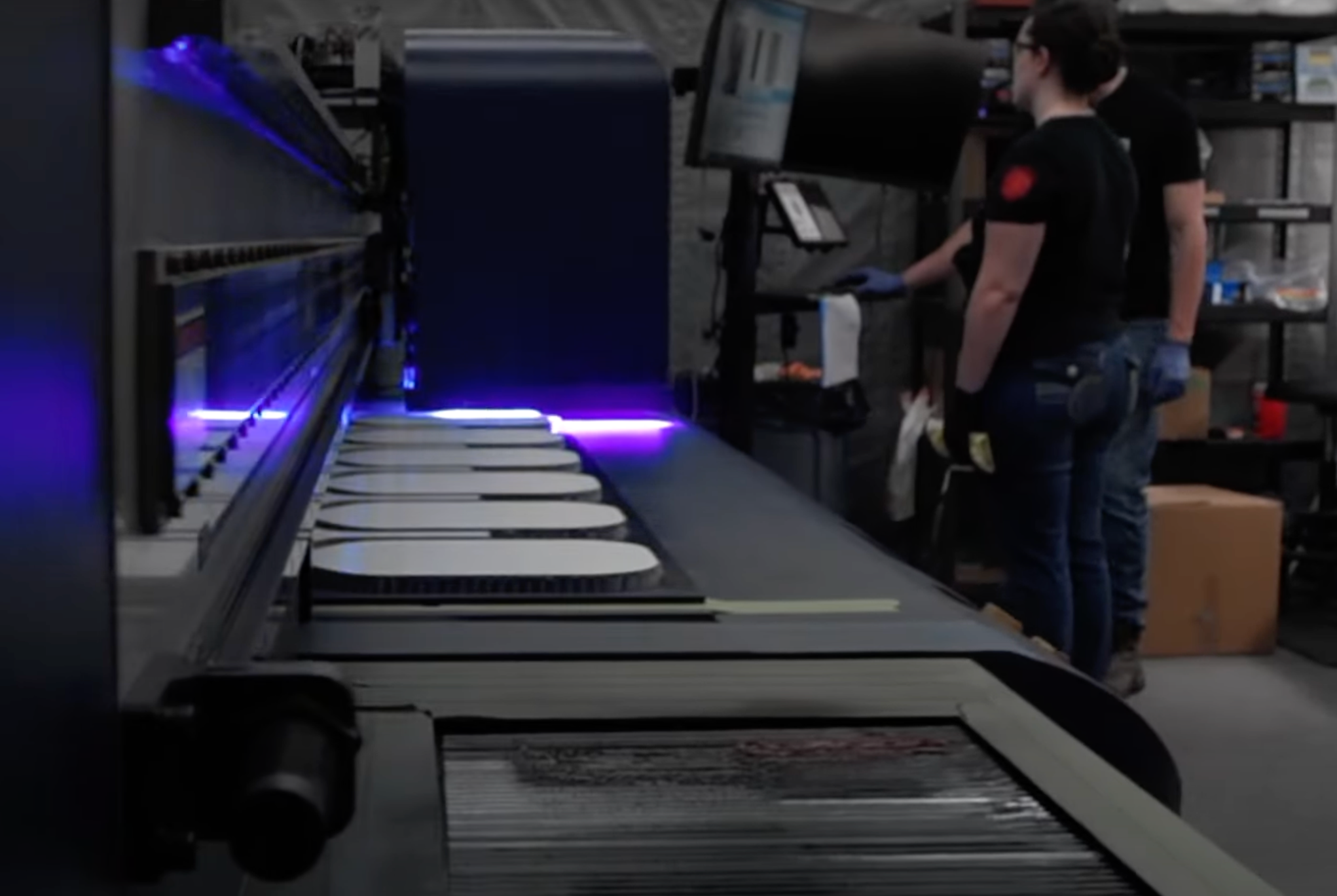 Production of Selkirk LABS pickleball paddles with paddles visible on the conveyor.