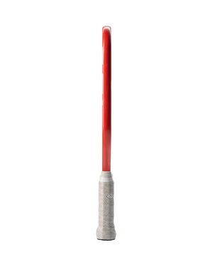 Red tennis racket shown in side profile with white wrapped grip on a white background.