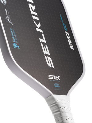 Selkirk paddle showing SELKIRK; SLK; BY SELKIRK; SELKIRK.COM; EVO; Parkinsons Foundation; PICK IT UP; USA PICKLEBALL