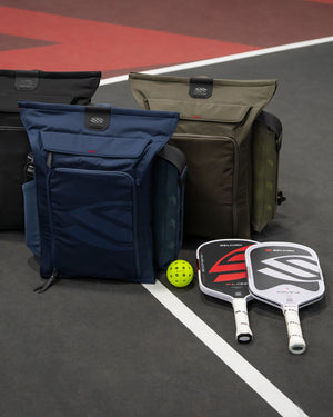 Selkirk Pro Line 2.0 Team 25L backpacks in Navy, Black and Earth Gray on court