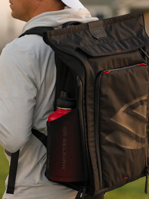 Player carrying the Selkirk Pro Line 2.0 Tour 35L backpack