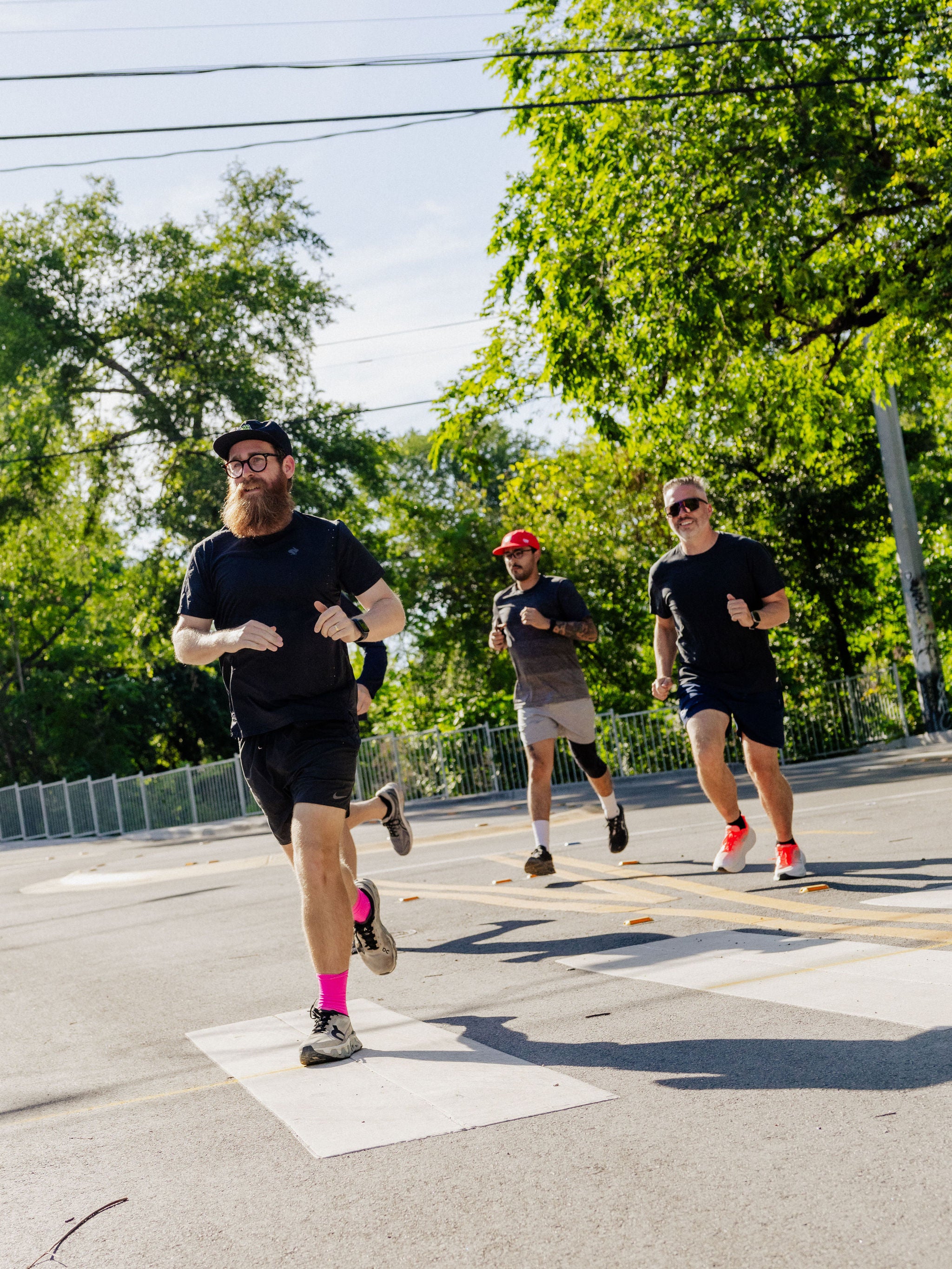 A group of men jog across a crosswalk in Austin, Texas. 