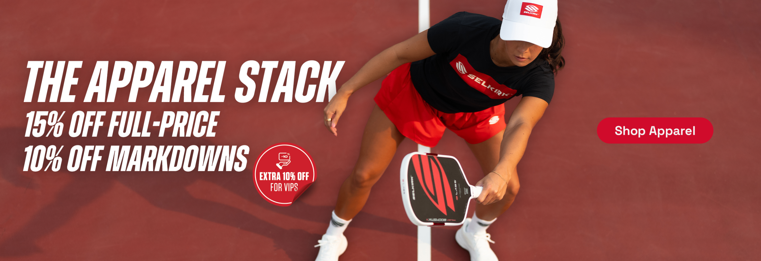 A woman playing pickleball on a court