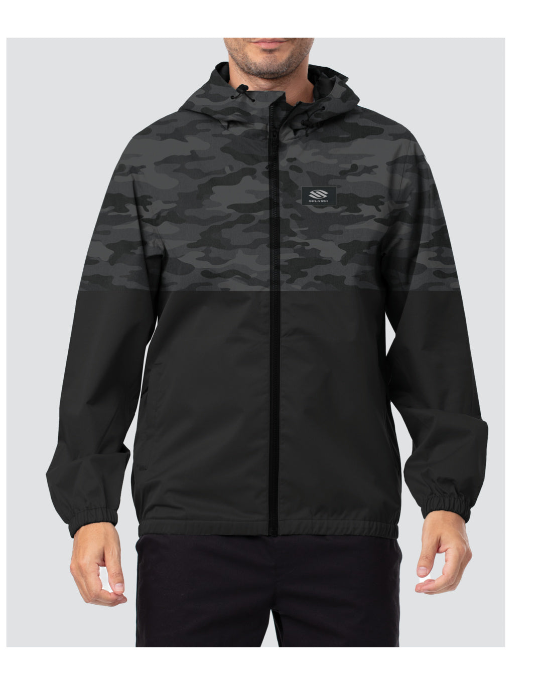 Black men's hooded windbreaker with gray camo upper panel, front zipper, elastic cuffs, and small rectangular chest logo