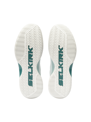 White shoe soles with wavy tread and teal 'SELKIRK' logo visible along each sole