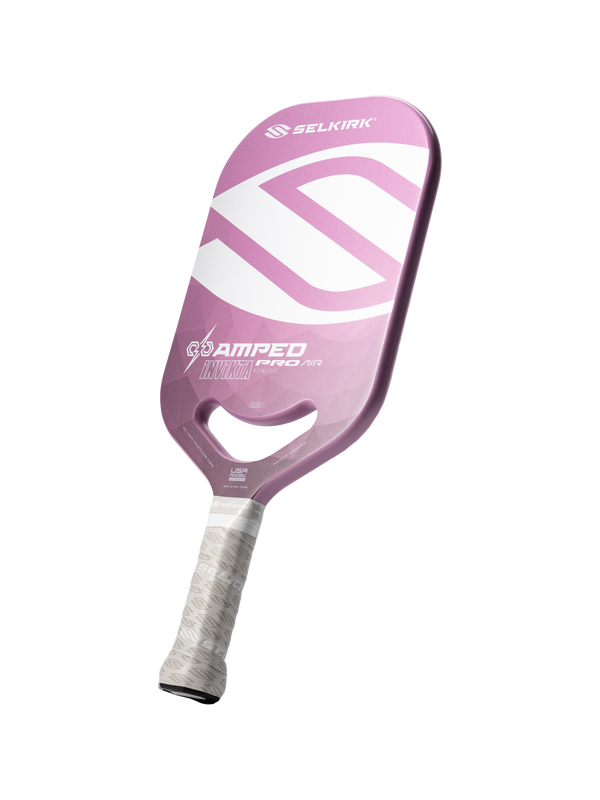 Pink Selkirk paddle with white 'SELKIRK' logo, 'AMPED PRO AIR', 'INVICTA' and small 'USA' text