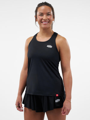 Woman wearing black athletic tank top and matching pleated skirt with white S logos on chest and skirt