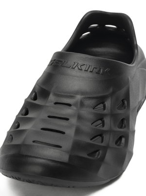 Angled front view of Selkirk Renew Recovery Shoe showing ventilated EVA upper and embossed SELKIRK logo on white background