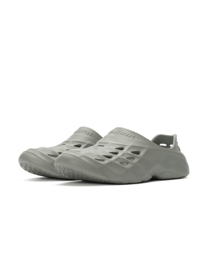 Pair of light gray slip-on foam clogs with vented uppers and molded soles, shown angled to the left.