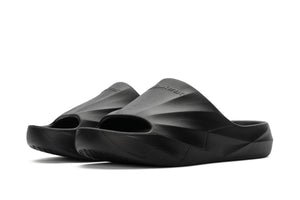 Black sculpted foam slip-on slides with open toe and contoured footbed