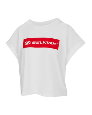 Front view of Selkirk Sport Women’s Sideline Soft Cotton Boxy Tee showcasing its red logo on white fabric