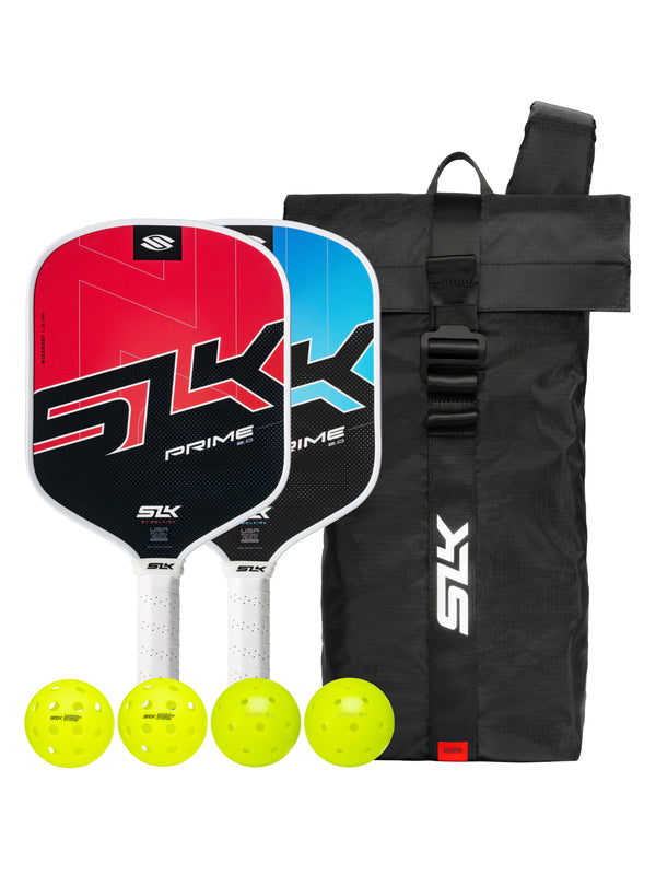 Two SLK Prime pickleball paddles (red and blue) with black SLK carry bag and four yellow SLK Hybrid balls.