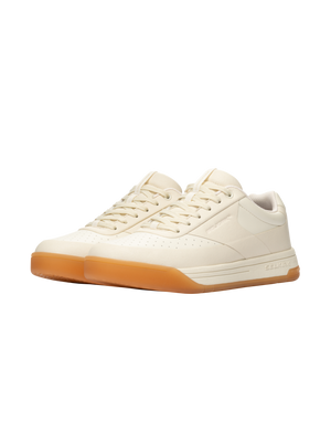 Three-quarter view of Selkirk Legacy Classic women’s pickleball shoes showcasing bone uppers and InfiniGrip gum outsoles
